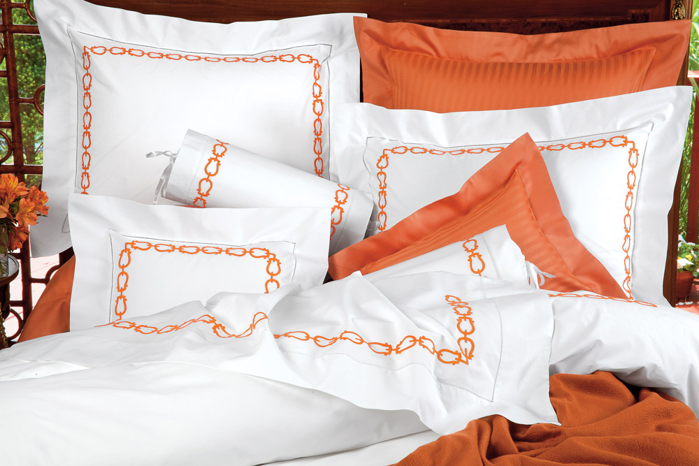 La Chaîn: lustrous 600 thread count White Egyptian cotton sateen from Italy is skillfully embroidered with unique chain links in Chocolate or Terracotta.