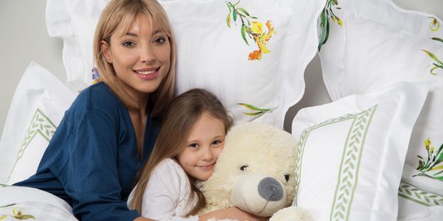 image of mother and daughter in bed