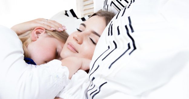 image of mother and daughter sleeping