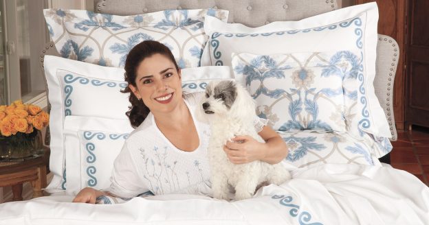 Image of Swirling with a woman and dog in bed