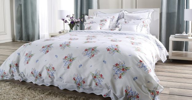 Modern bedroom with bed dressed in the Country garden design.