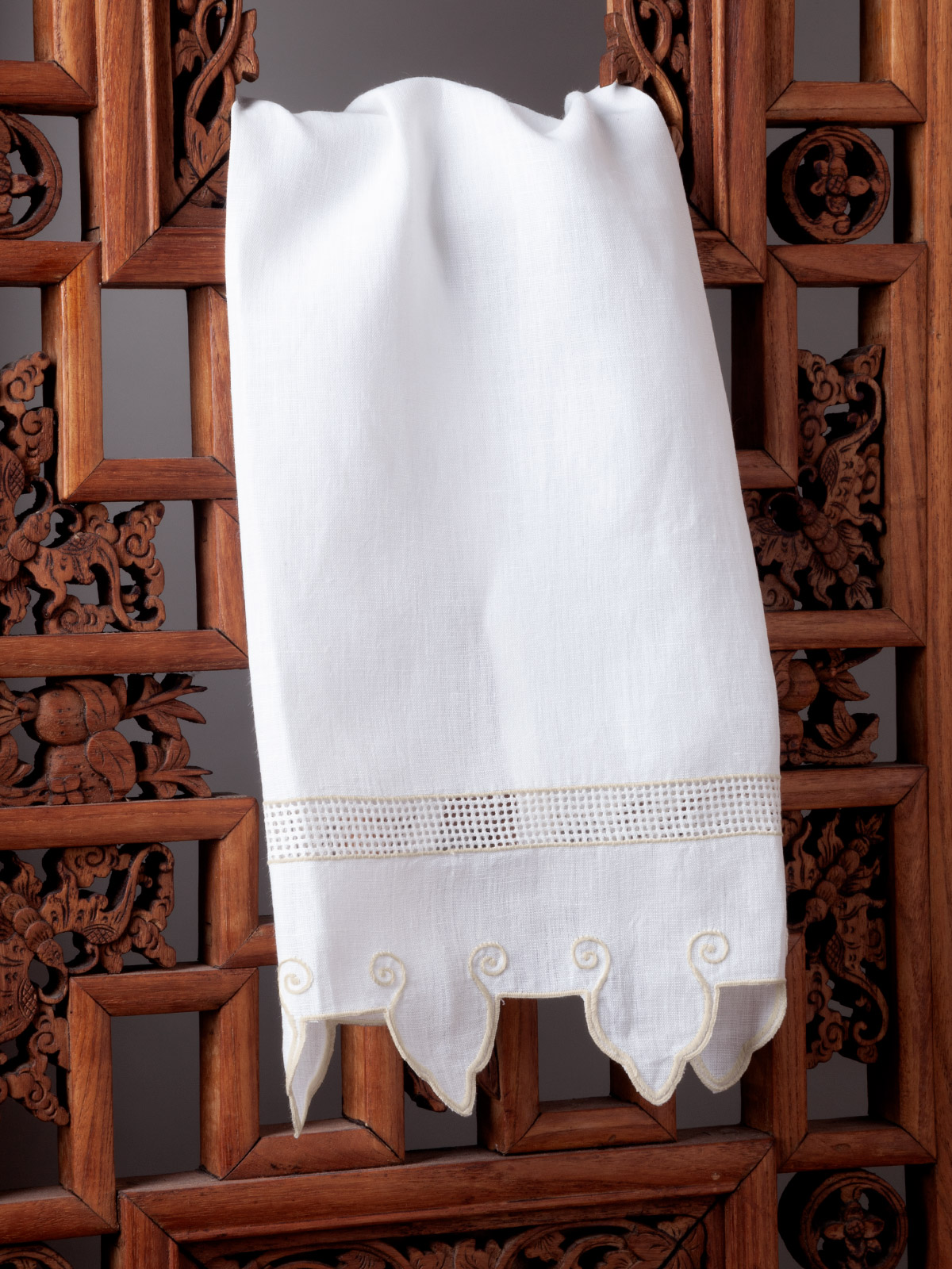 Image of the Wellington Court guest towel featuring classic embroidery and refined scalloped edges