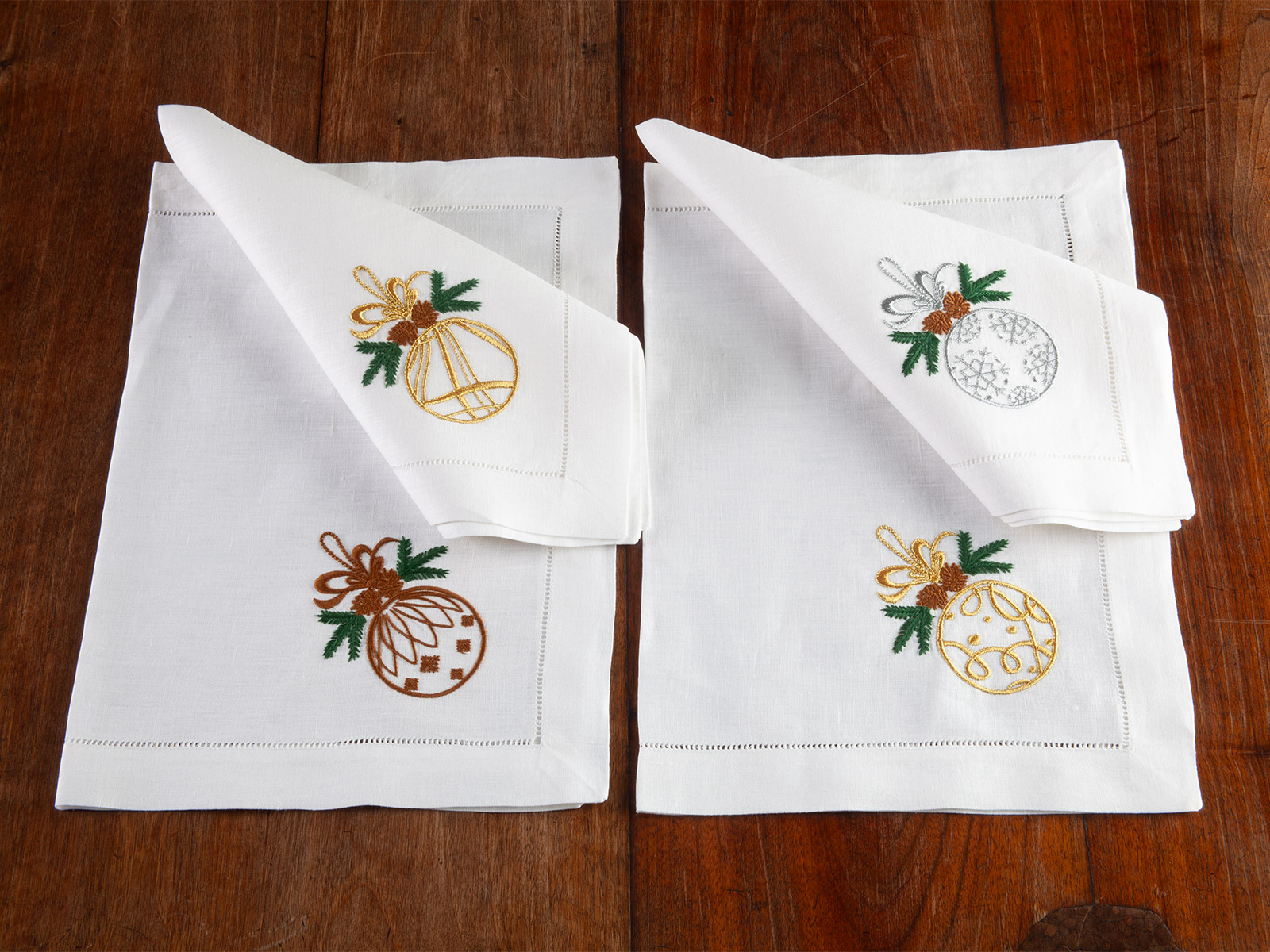 Image of the Noel Christmas table collection with holiday-themed embroidered placemats and linens