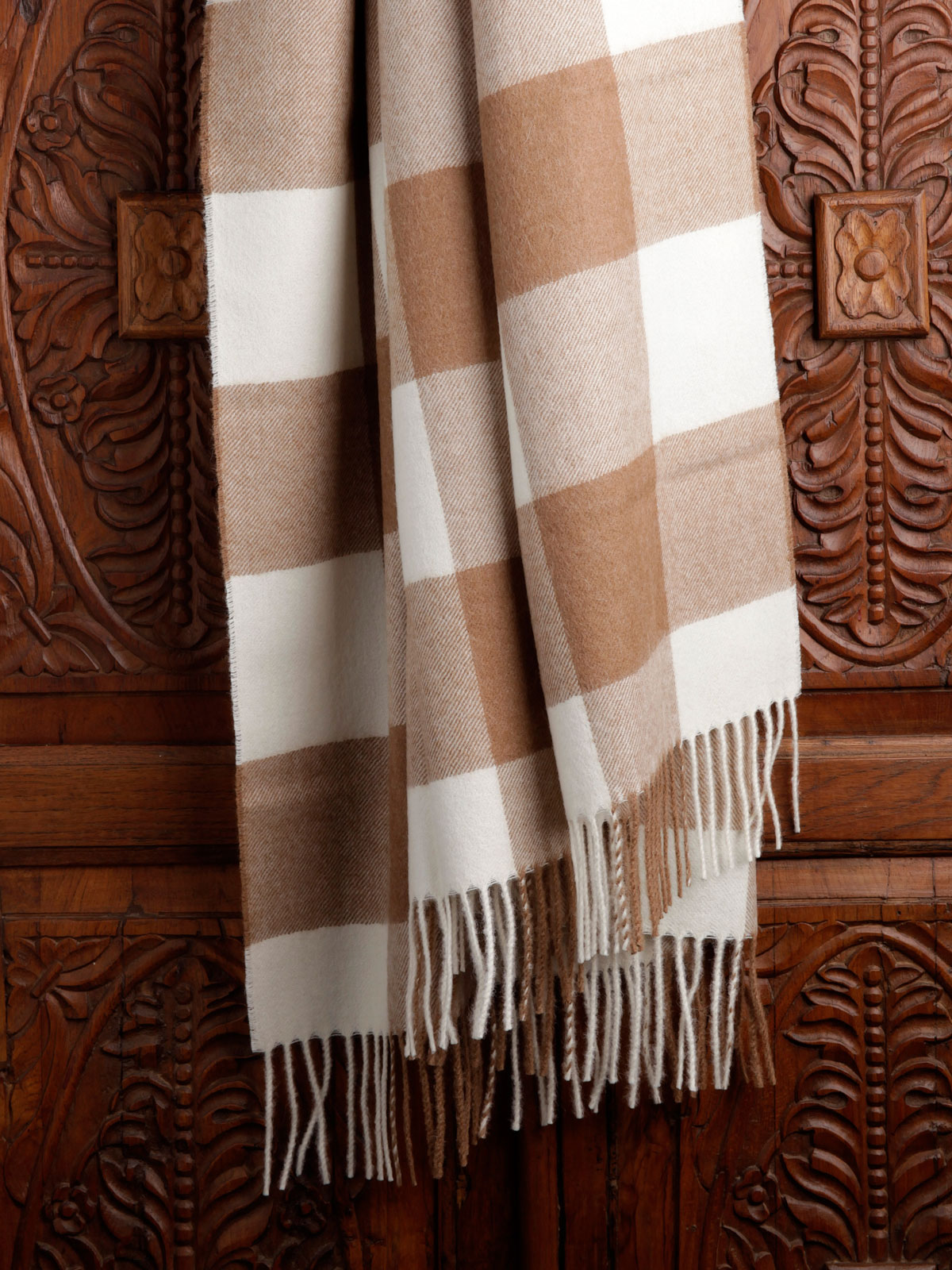 Image of the Quadratis alpaca throw with geometric pattern and soft, luxurious texture