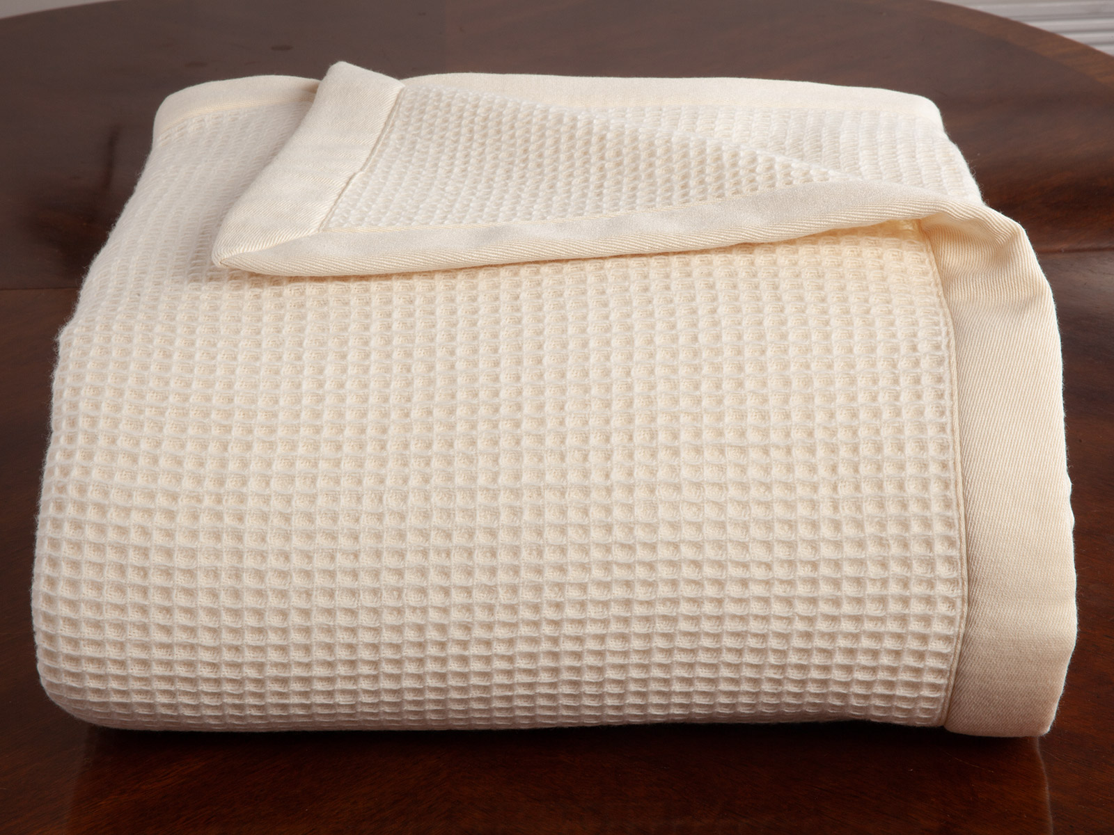 Image of the Linhaven blanket featuring rich texture, refined patterning, and cozy winter styling