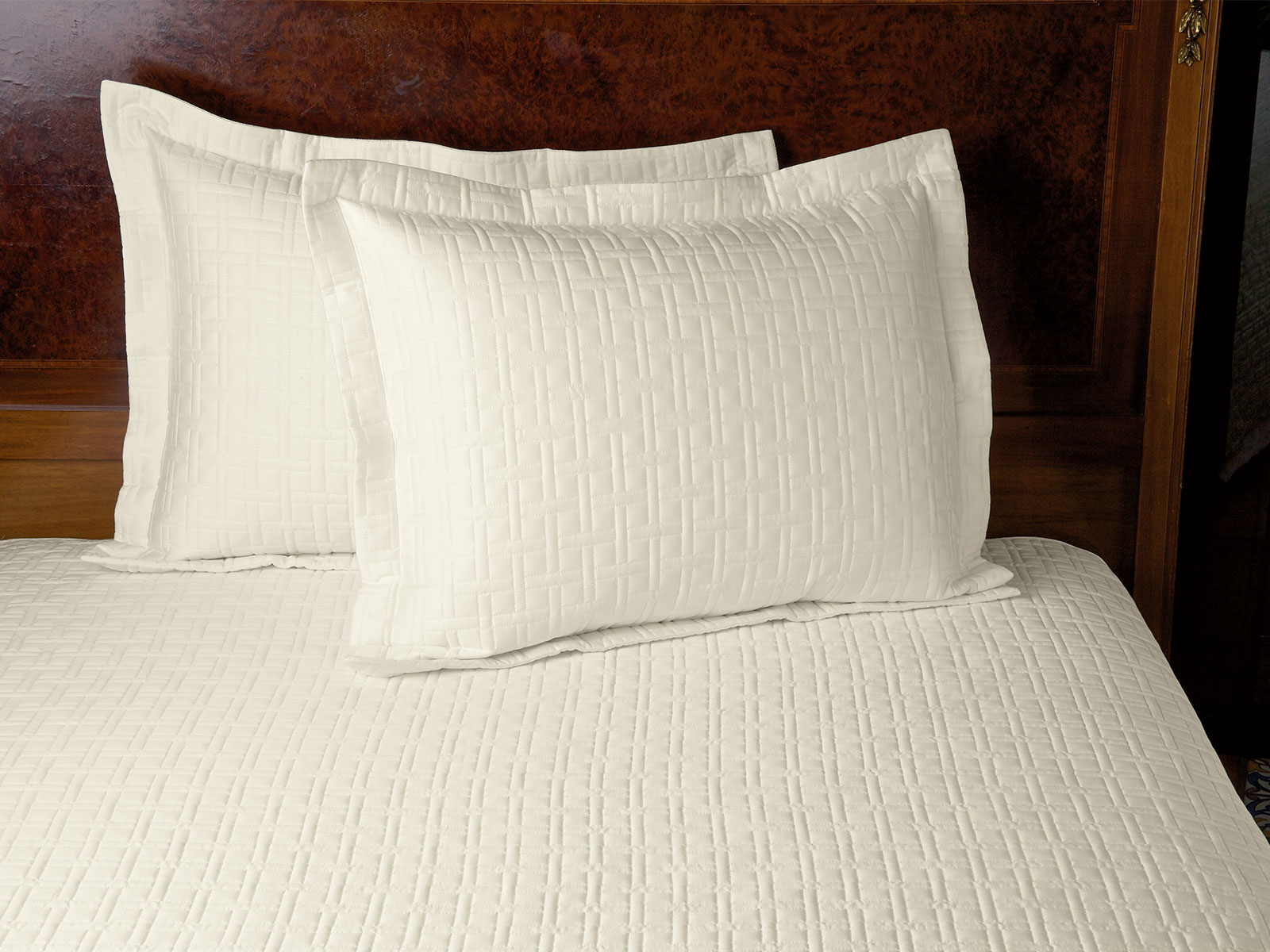 Image of the Quiltessence collection featuring quilted ivory bedding in soft Egyptian cotton sateen