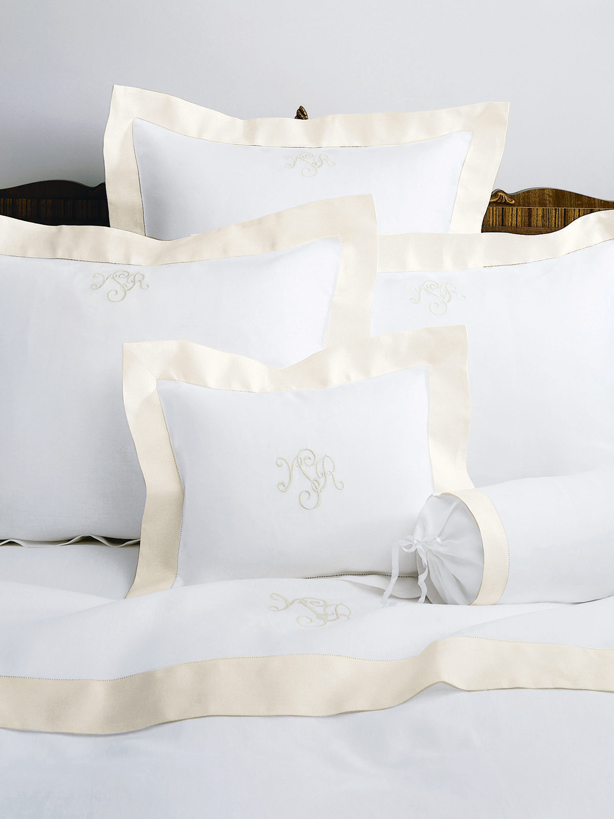 Image of the Camelot bedding collection with layered linens and soft, tranquil styling