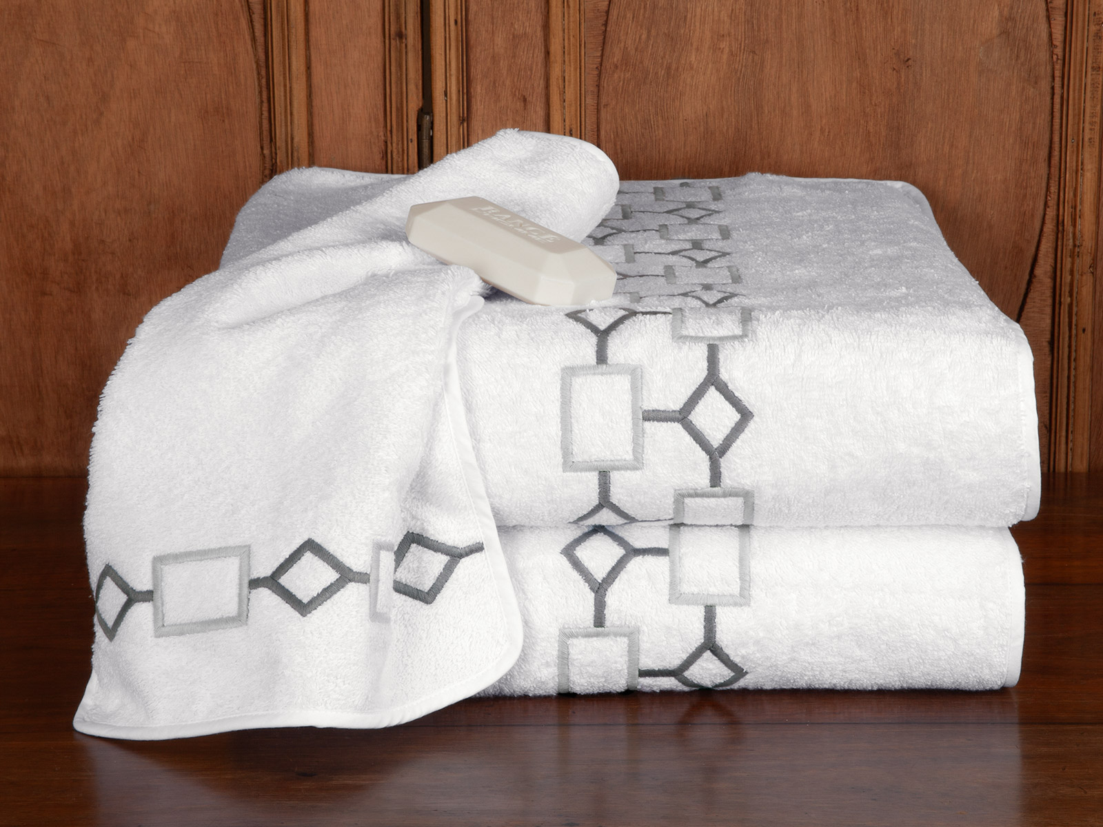 Image of Diamond District luxury bath towels featuring plush cotton and elegant embroidered detailing