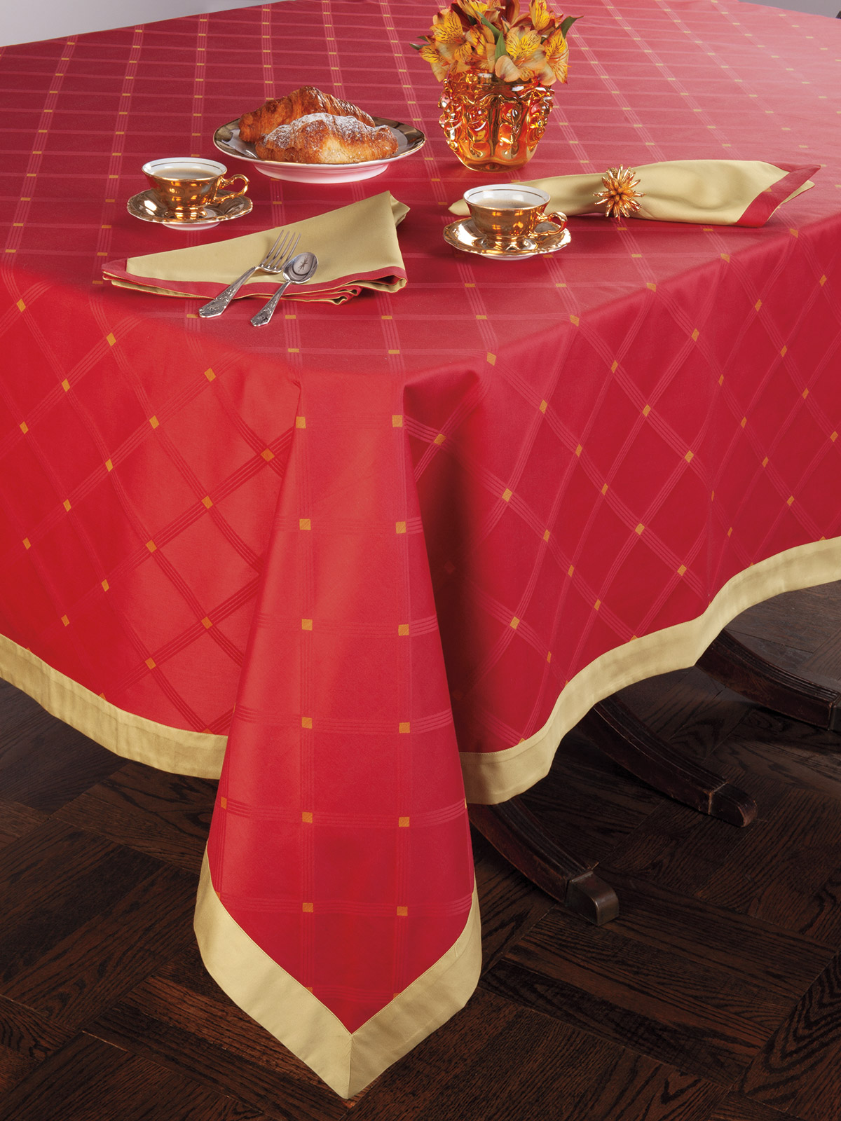 Image of the Botticello tablecloth featuring rich red damask and elegant gold accents