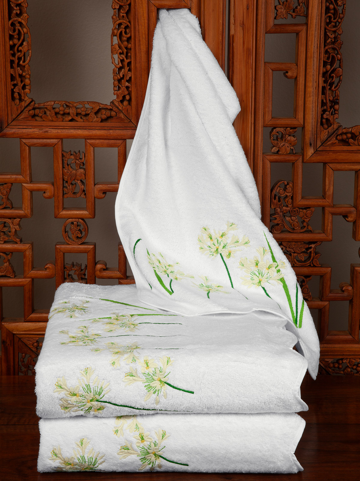 Image of Wildflower Hill towels featuring elegant floral embroidery and plush cotton construction