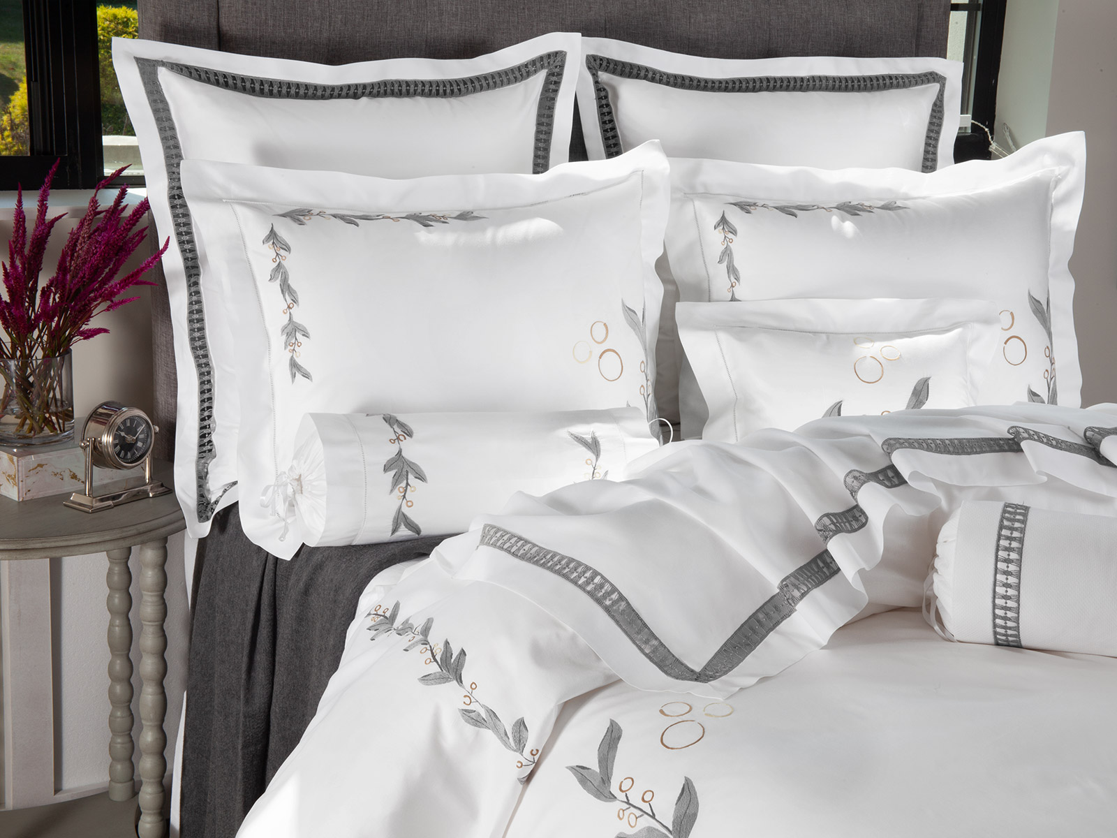 Gray Grove bedding featuring crisp white fabric, tailored embroidery and refined boutique hotel styling