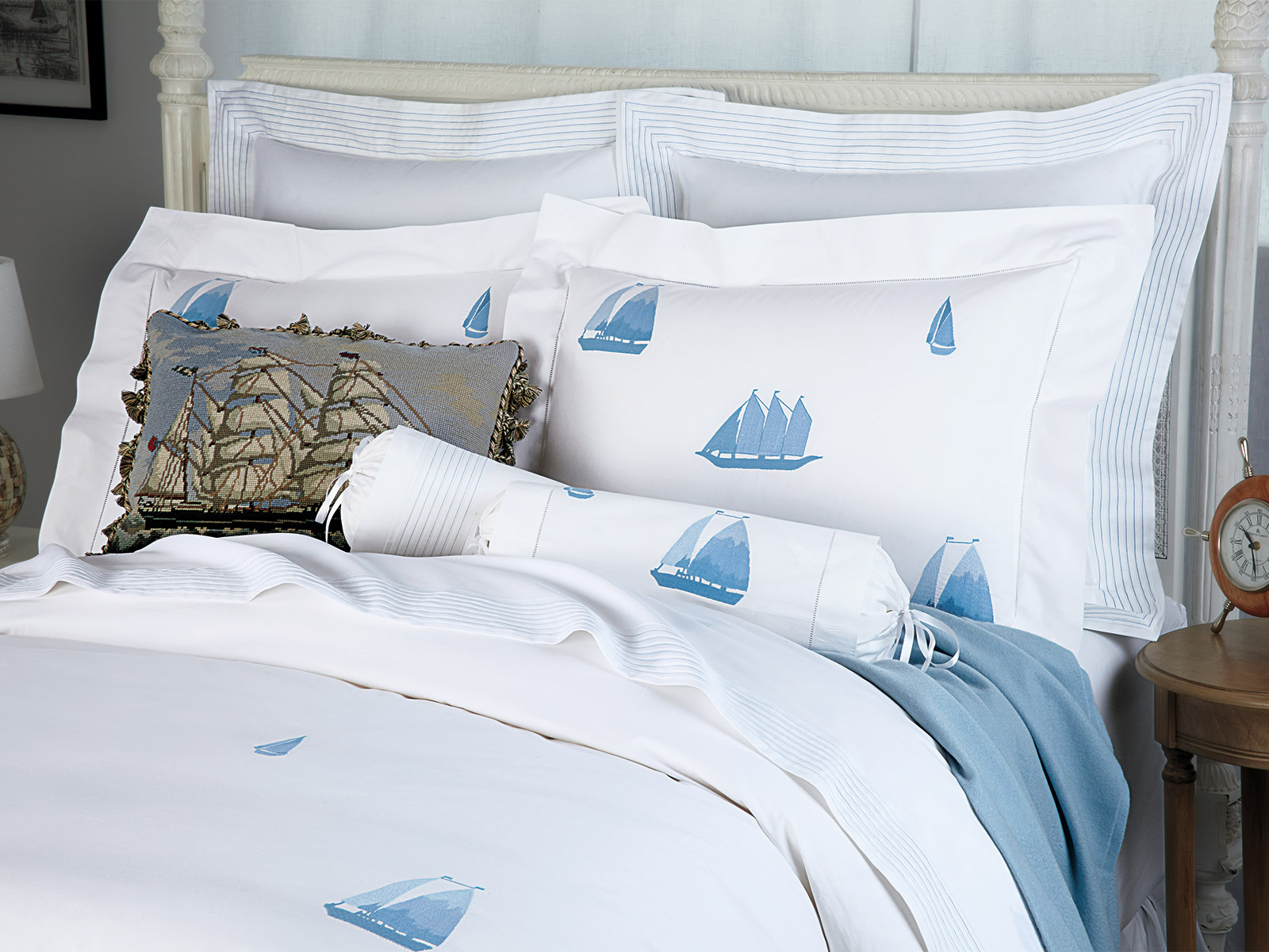 Windward bedding styled with soft coastal colors, lightweight textures and a relaxed seaside-inspired elegance.
