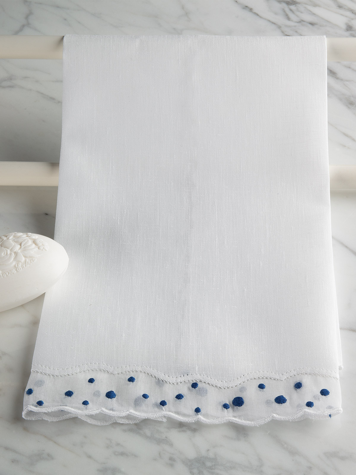 Image of Manor House guest towels with elegant decorative detailing and a refined luxury bathroom presentation.
