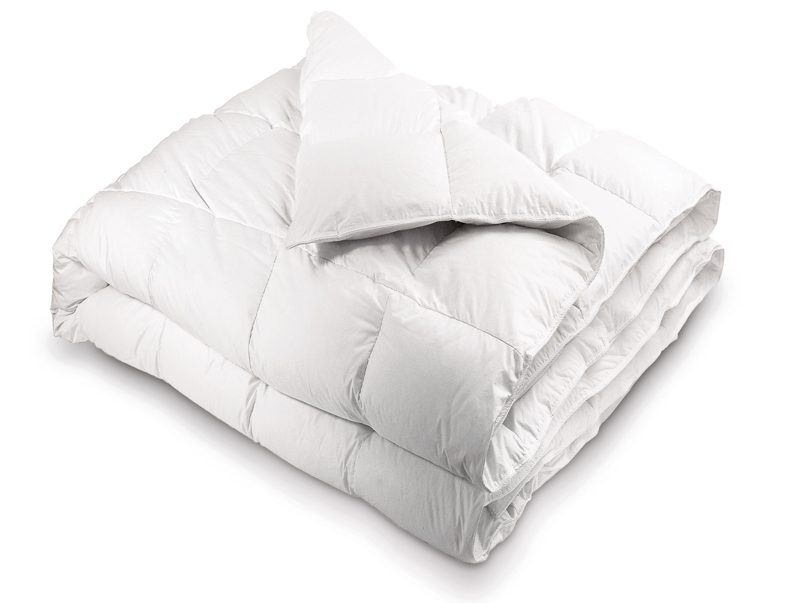 Image of a plush down comforter creating a warm, lofty and inviting luxury bed.